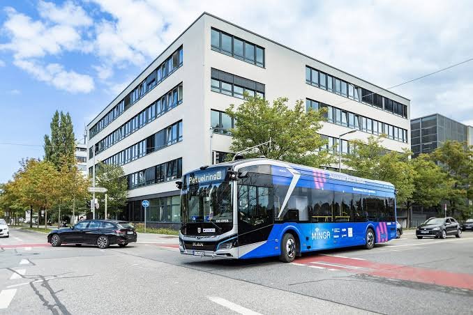 A rapid transit bus beside new offices